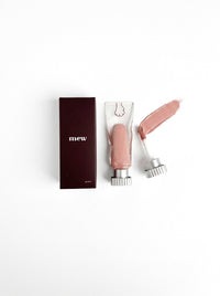 mew lip glaze in Soft, a bare nude, with its swatch