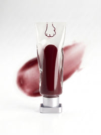 mew lip glaze in Kiss, a wet wine red, with its swatch
